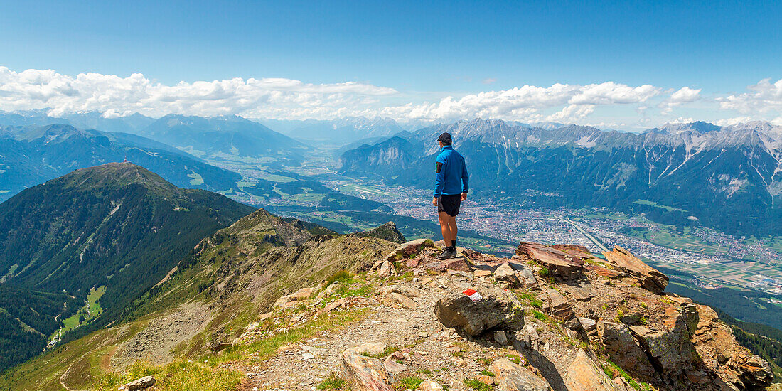 A mountaineer on the summit of Sonnenspitze peak, Glungezer mountain, Tulfes, Innsbruck Land, Tyrol, Austria, Europe
