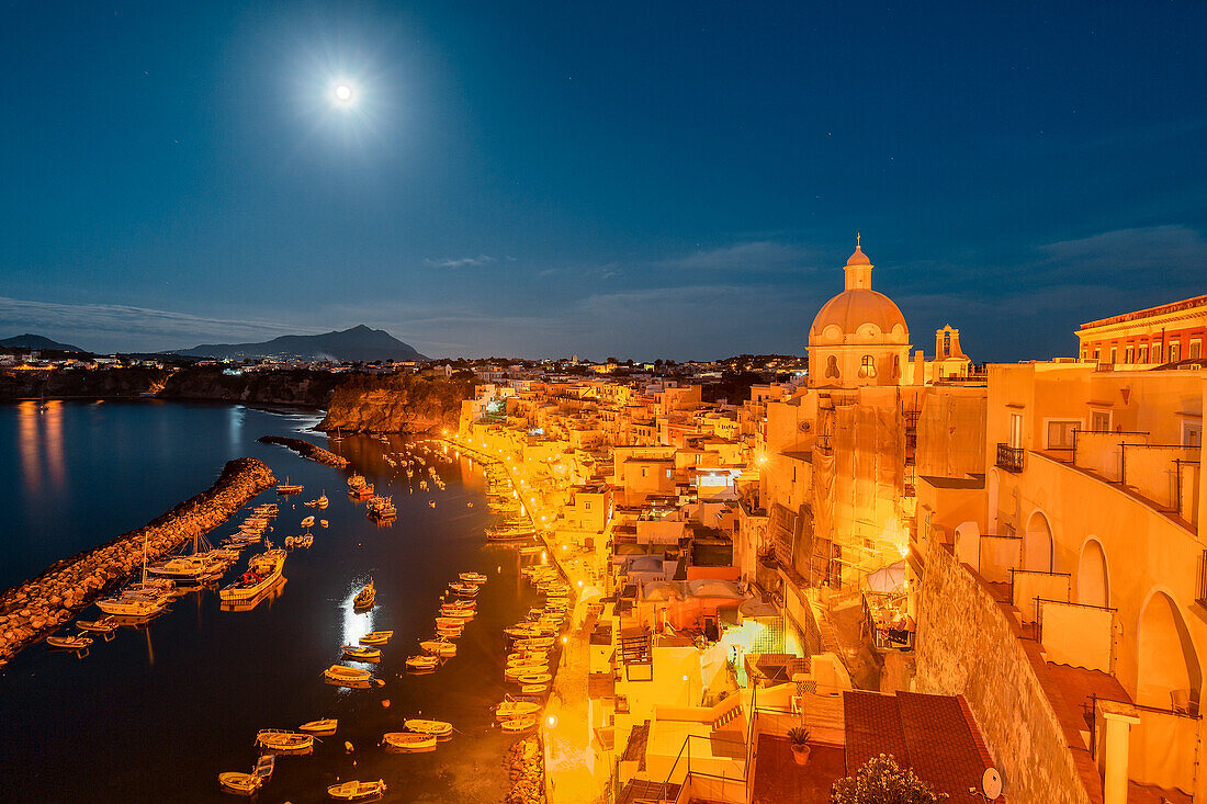 The famous Marina di Corricella on an early morning with the moonlight, Procida Island, Campania region, Italy, Europe
