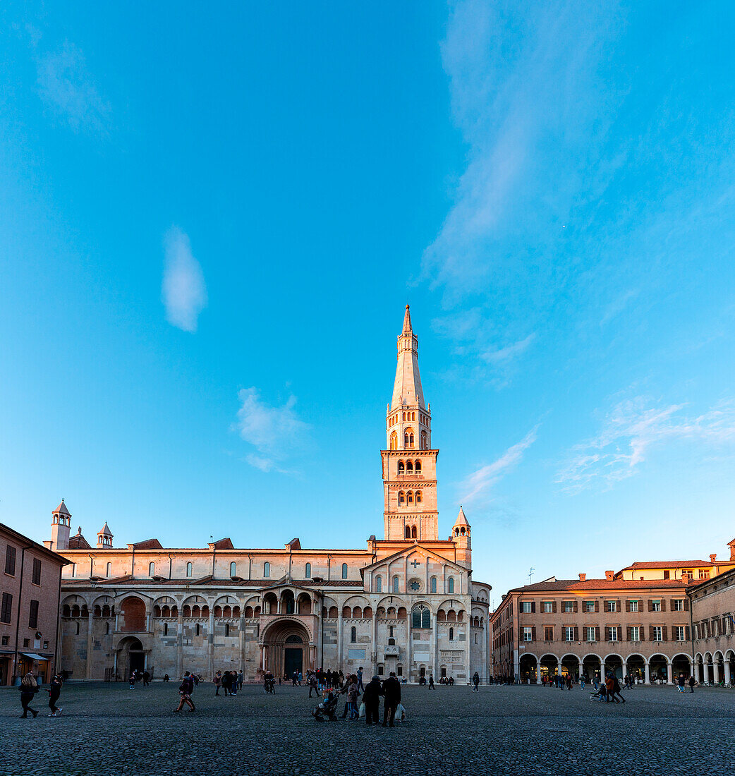 Modena, Emilia Romagna, Italy. Cathedral and Ghirlandina Tower in the city center. Piazza Grande at sunset