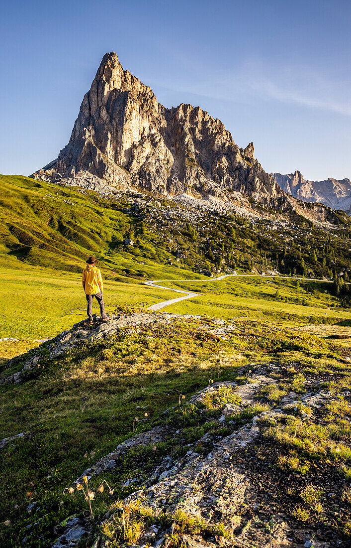 Italy, Veneto, province of Belluno, hiker admires mount La Gusela at Giau pass (MR)