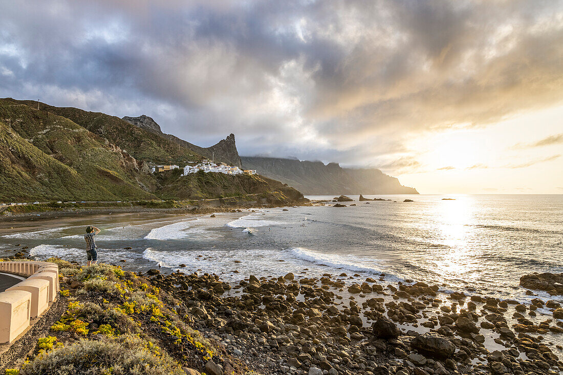 Spain,Canary Islands,Tenerife,Anaga Rural Park,Almaciga,a man photographing at sunset (MR)