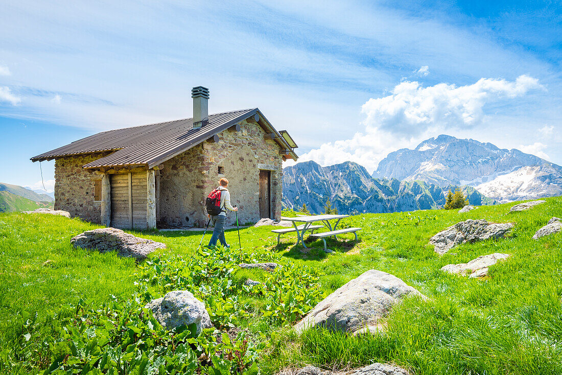 Hiker at baita Monte Campo, Val Brembana, Alpi Orobie, province of Bergamo, Lombardy, Italian alps, Italy