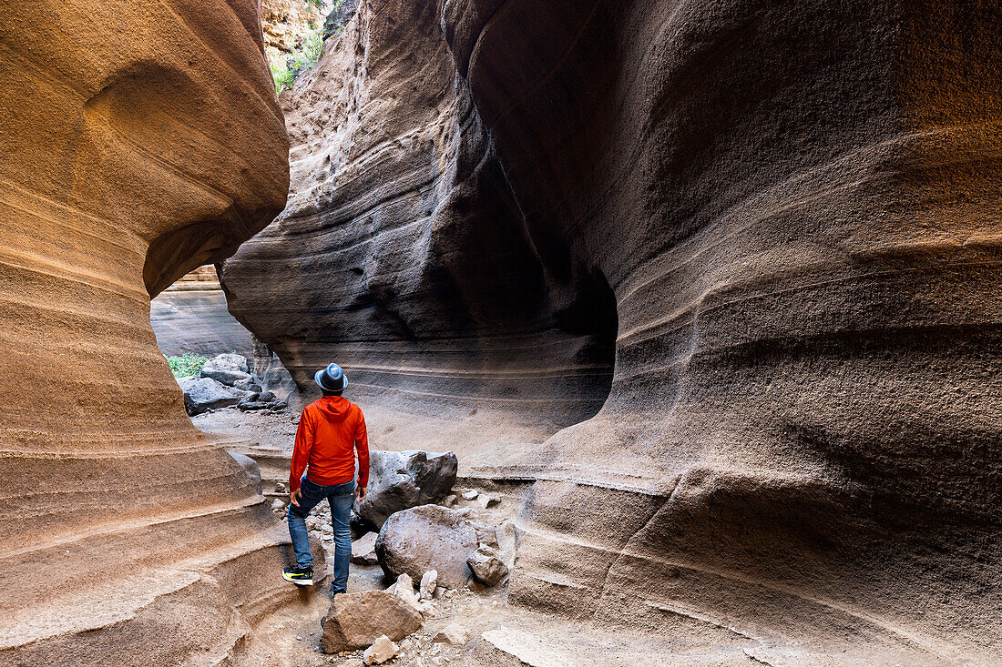 Spain, Canary Islands, Gran Canaria,Las Palmas, a man standing in the canyon of Barranco de Las Vacas (MR)