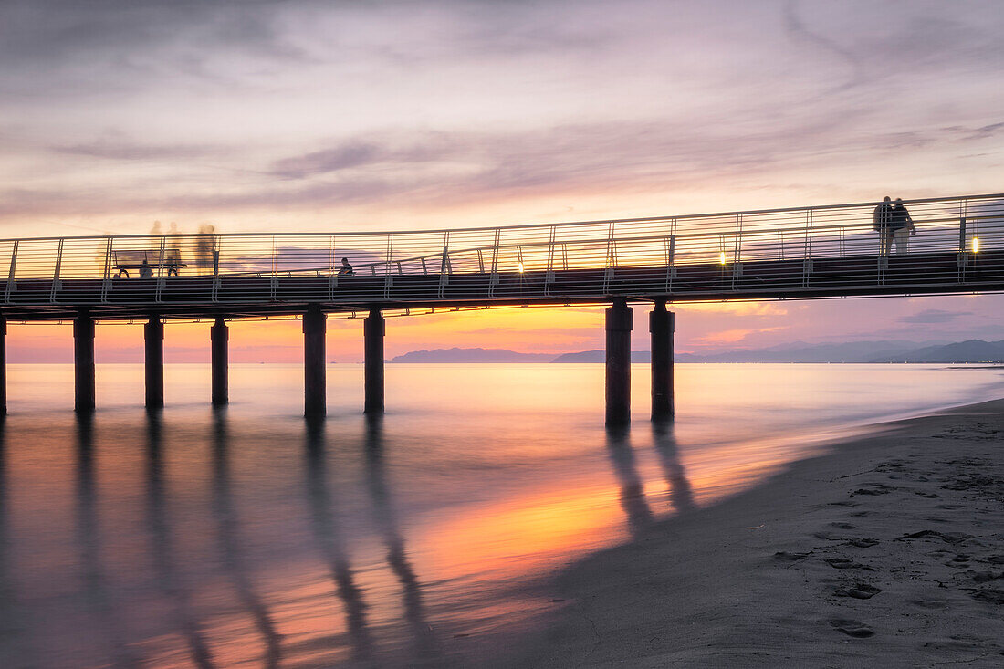Long exposure at sunset on the pier of Lido di Camaiore, Lucca province, Versilia, Tuscany, Italy, Europe