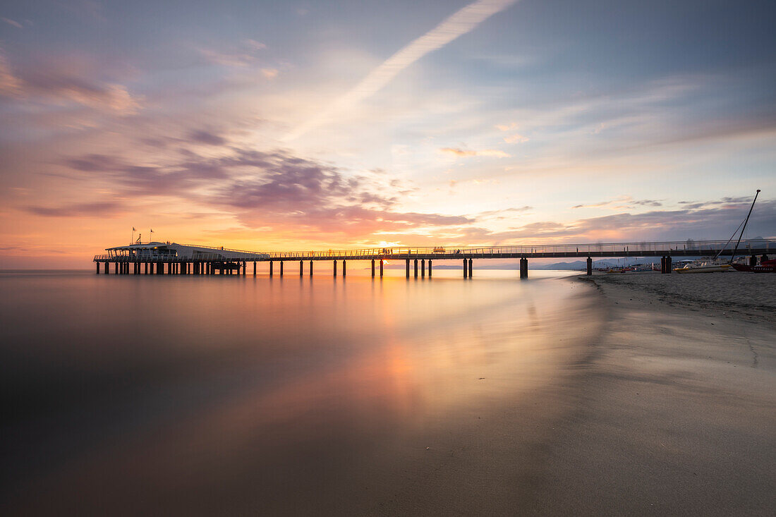 Long exposure at sunset on the pier of Lido di Camaiore, Lucca province, Versilia, Tuscany, Italy, Europe