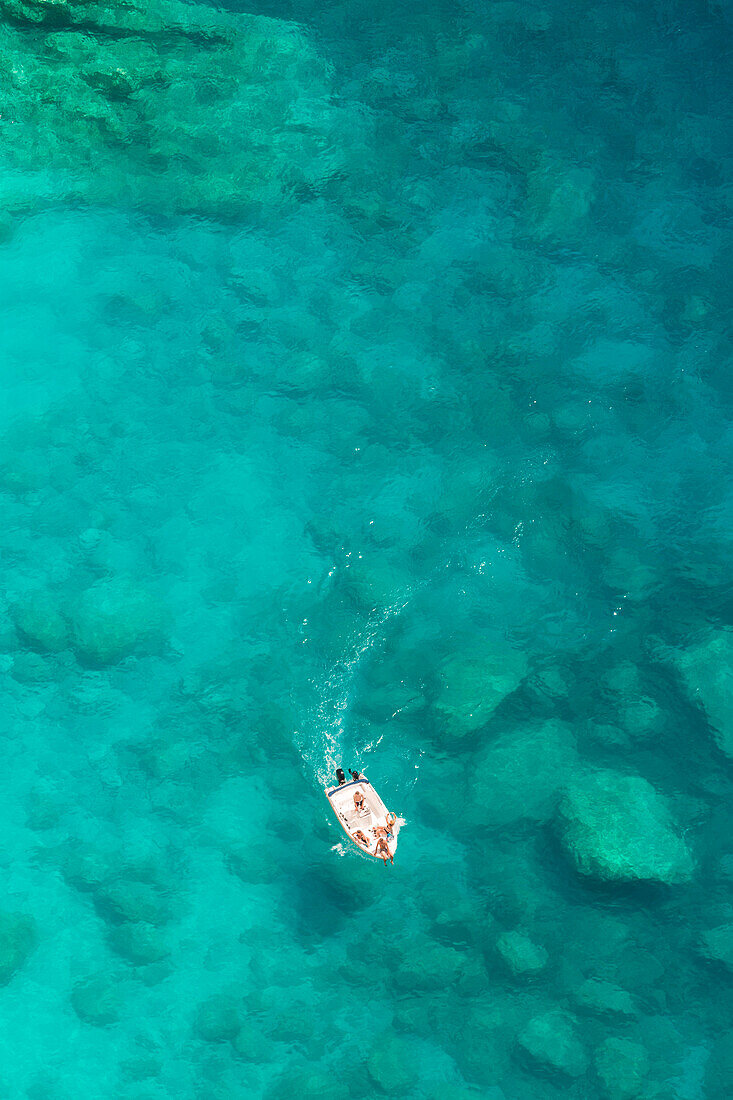 Little boat sailing in the ionian sea near Shipwreck beach, Zakynthos, Ionian Islands, Greece, Europe