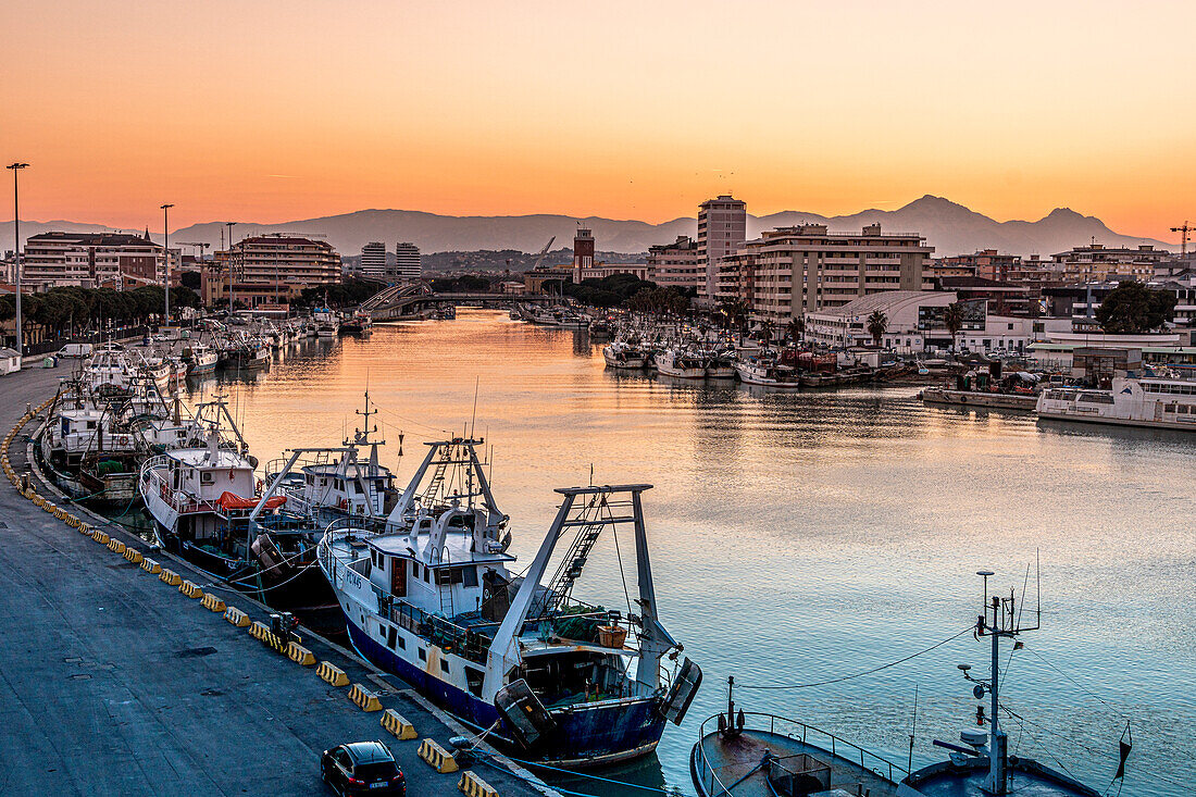 The canal port of Pescara, in the background the Gran Sasso chain at sunset. Pescara, Abruzzo, Italy, Europe