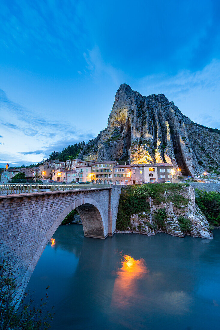 The road bridge of Sisteron by night with the rocher de la Baume in background. Sisteron, Durance valley, Provence, France, Europe.