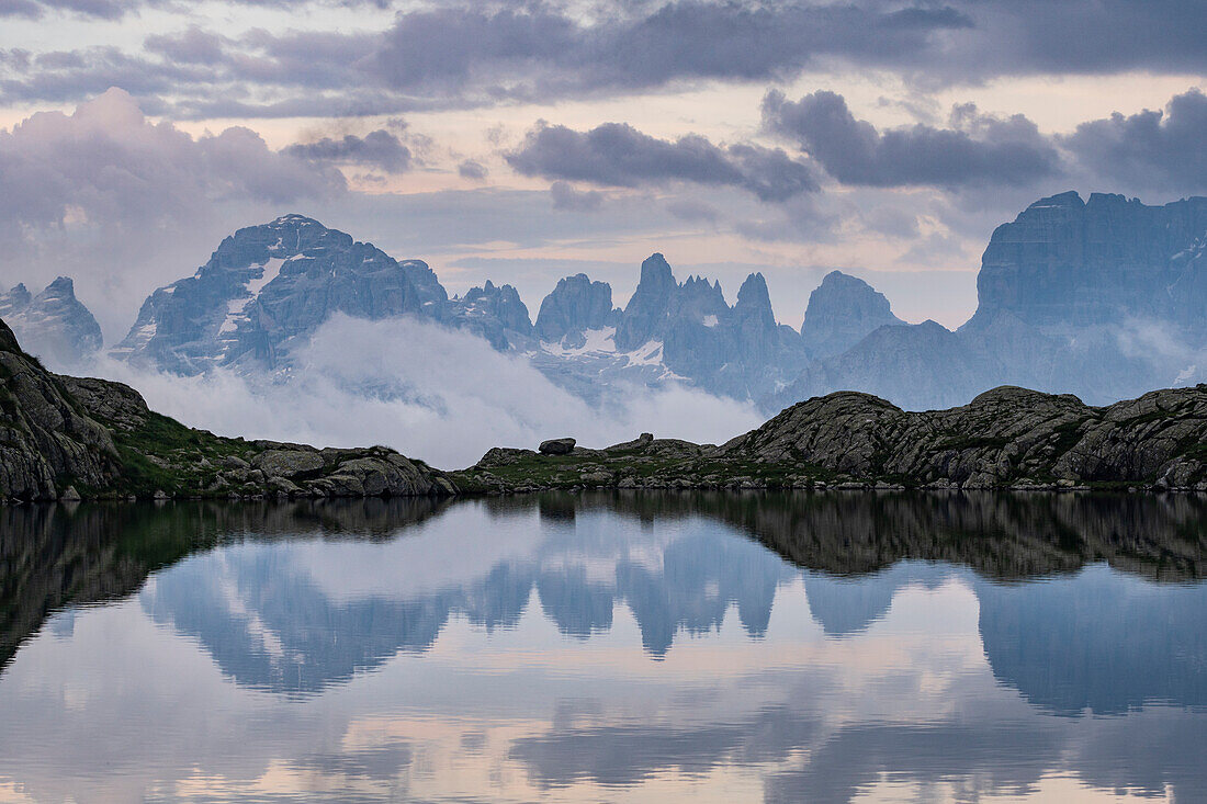 Brenta Dolomites reflected in the Lago Nero at sunset. Nambrone valley, Madonna di Campiglio, Trentino Alto Adige, Italy, Europe.