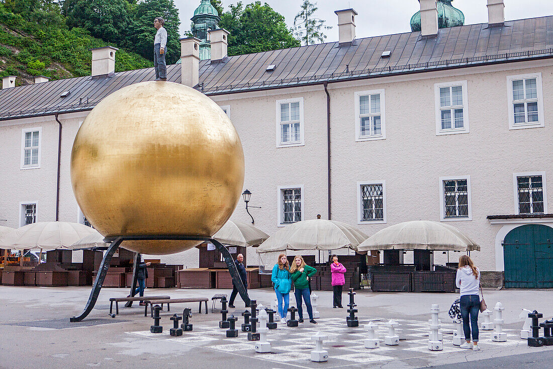 The Golden Sphere by Stephan Balkenhol and chess players, Salzburg, Austria