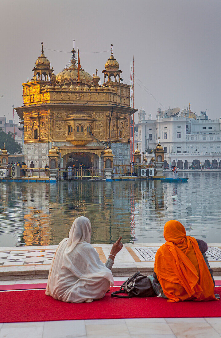 pilgrims and sacred pool Amrit Sarovar, Golden temple, Amritsar, Punjab, India