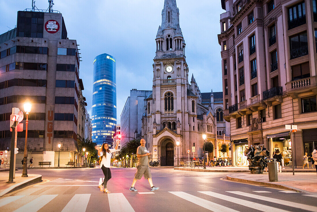 Crosswalk, in Plaza San José, whith San José de la Montaña church and Iberdrola tower, , Bilbao, Spain