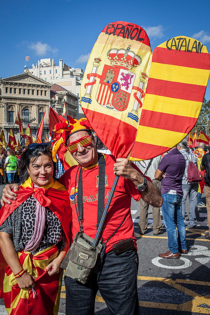 Anti-independence Catalan protestors carry Spanish and catalan flag during a demonstration for the unity of Spain on the occasion of the Spanish National Day at Passeig de Gracia, Barcelona on October 12, 2014, Spain
