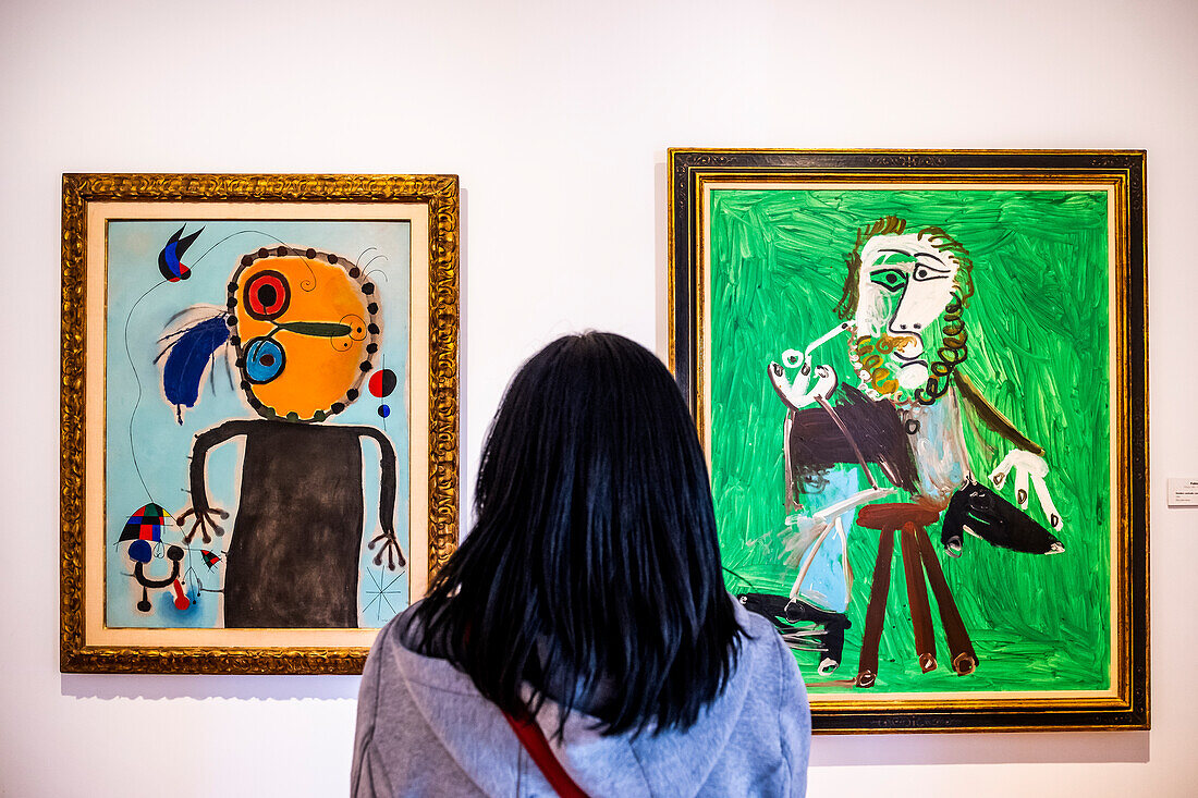At left `el disco rojo persiguiendo a la alondra´by Joan Miró. At right `Hombre sentado con pipa´by Pablo Picasso, Botero Museum, Bogota, Colombia