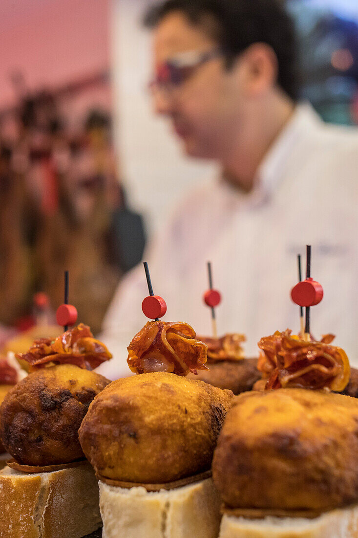 Pintxos, area of bars and restaurants, in La Ribera market, Bilbao, Spain