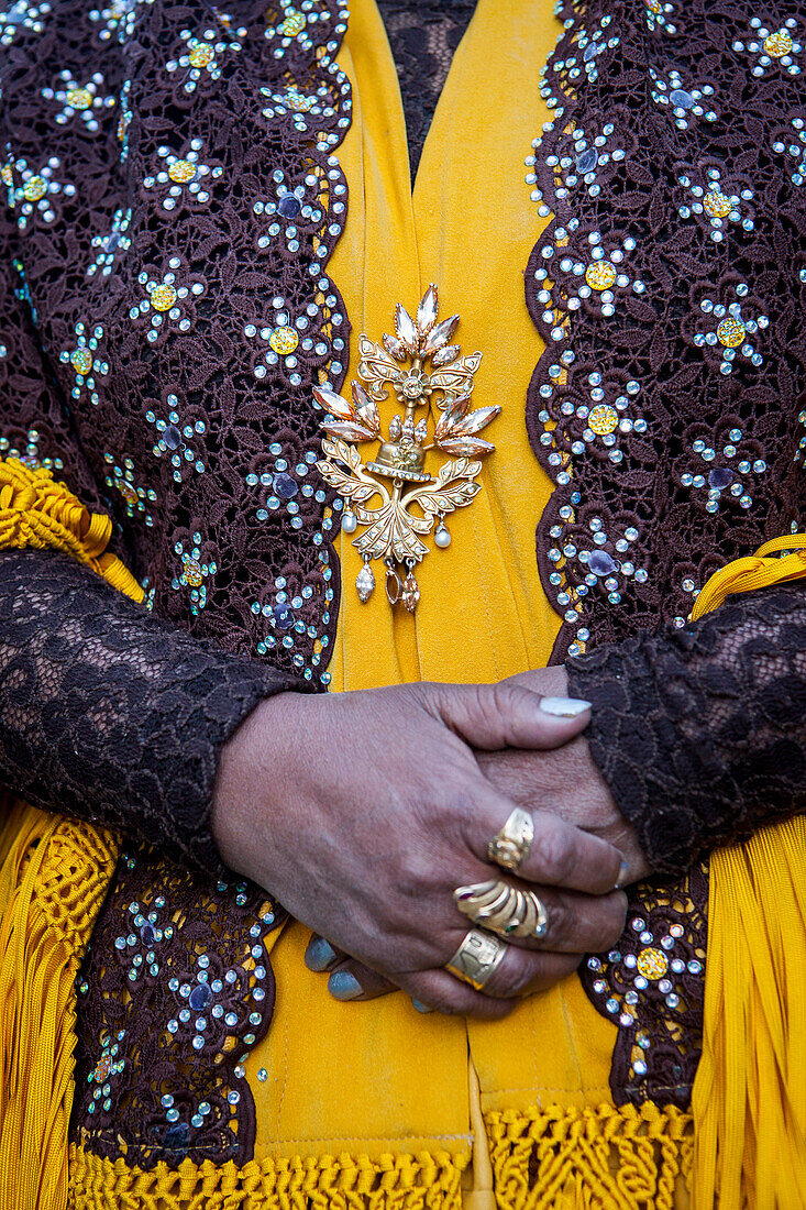 Angela la Folclorista, detail of her dress and hands, cholita female wrestler, El Alto, La Paz, Bolivia