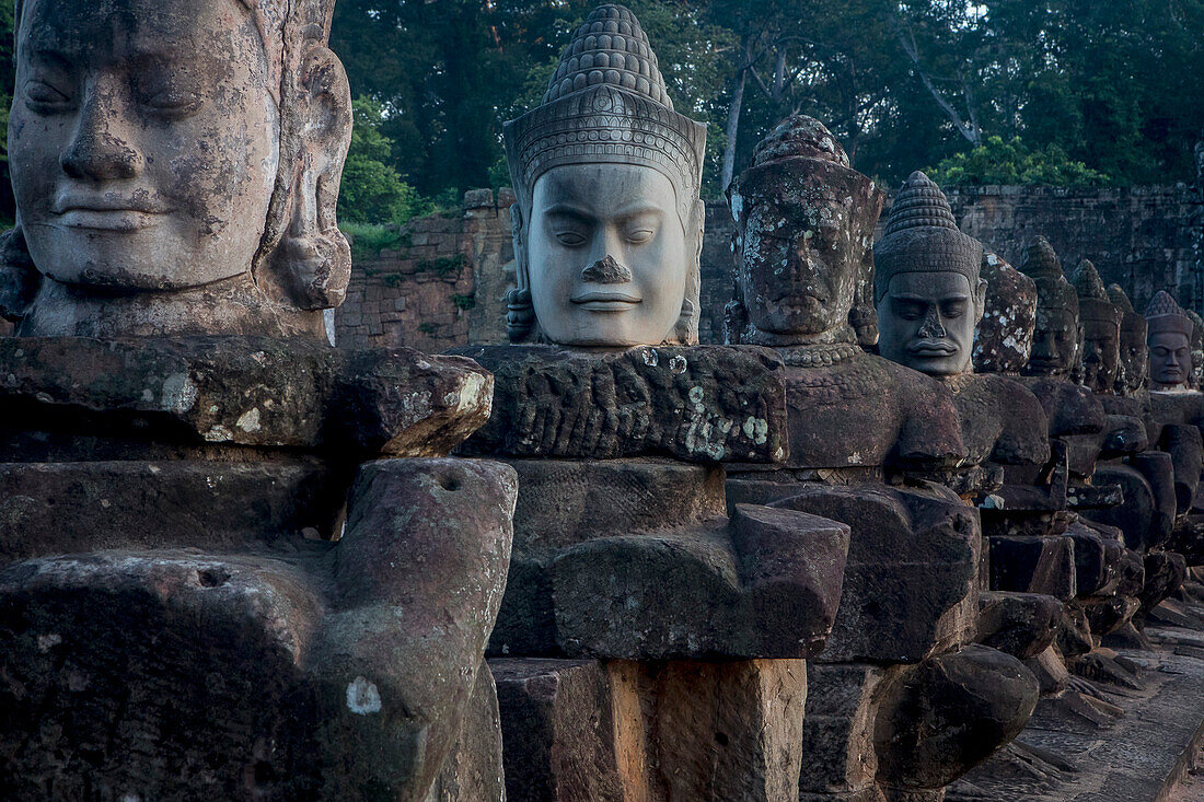 Detail, statues of Asuras on bridge of South Gate, in Angkor Thom, Siem Reap, Cambodia