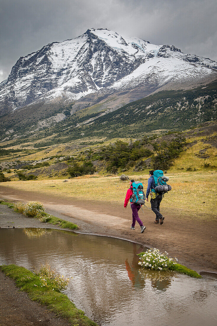 Hikers walking in Torres Sector, Torres del Paine national park, Patagonia, Chile