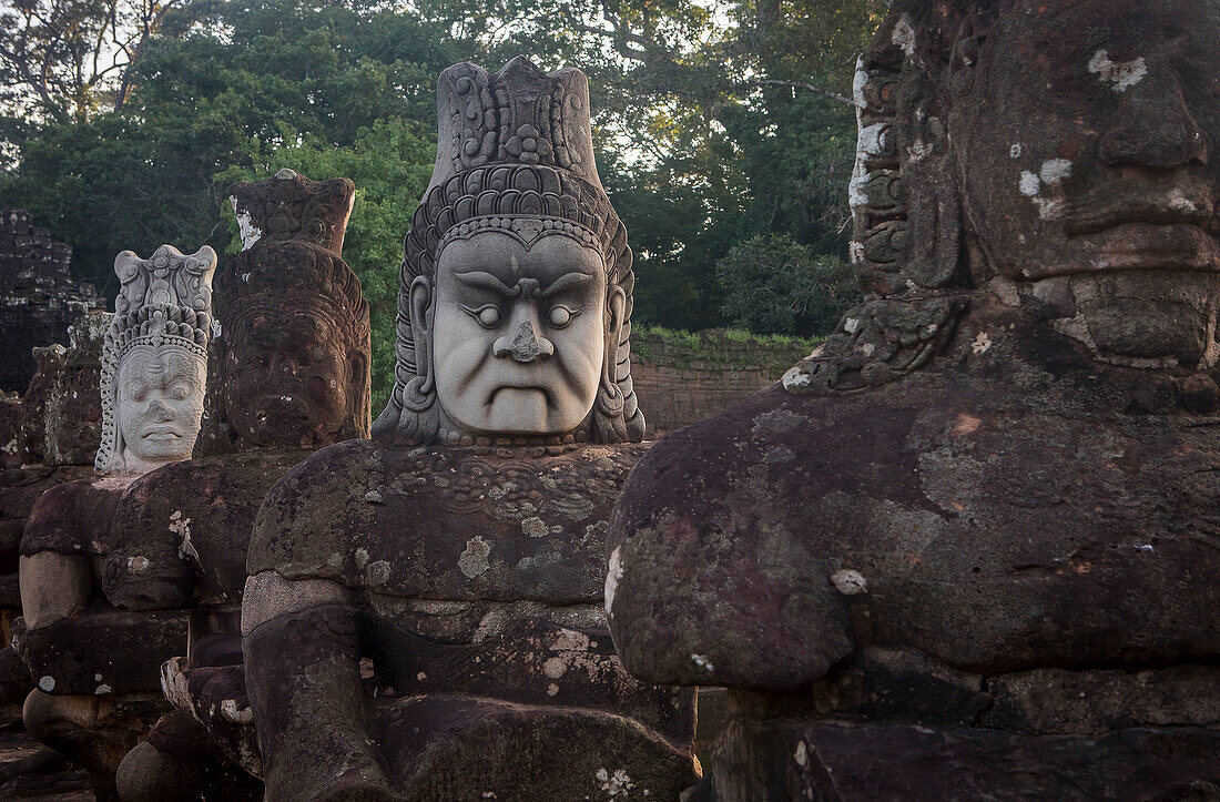 Detail, statues of Asuras on bridge of South Gate, in Angkor Thom, Siem Reap, Cambodia