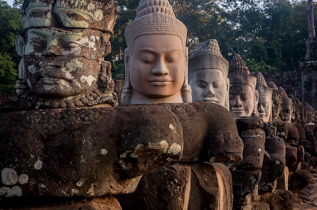 Detail, statues of Asuras on bridge of South Gate, in Angkor Thom, Siem Reap, Cambodia