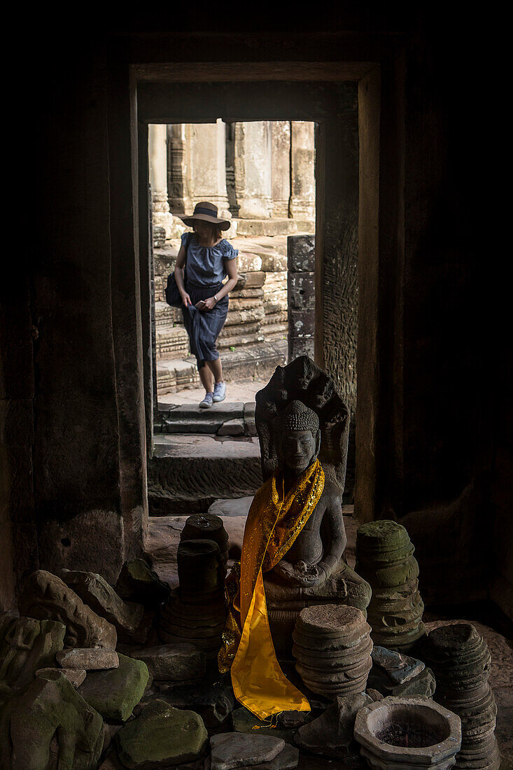 Tourist, in Bayon temple, Angkor Thom, Angkor, Siem Reap, Cambodia