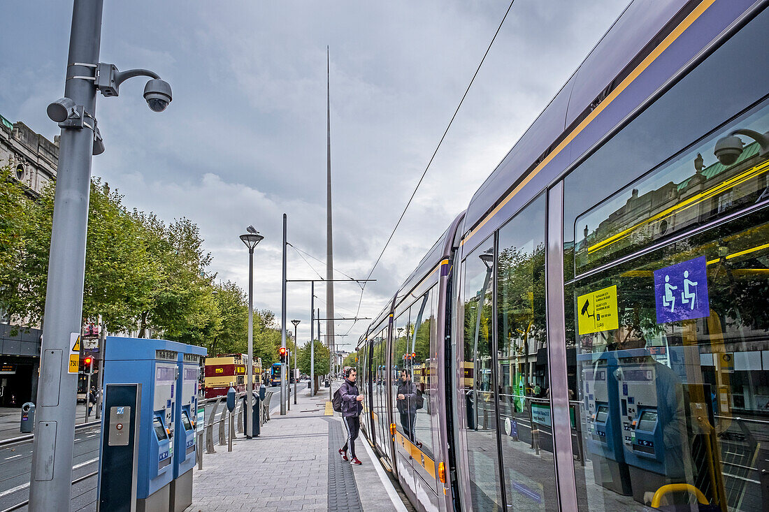 Tram in O'Connell Street, in background Spire of Dublin also known as Monument of Light by Ian Ritchie Architects, Dublin, Ireland