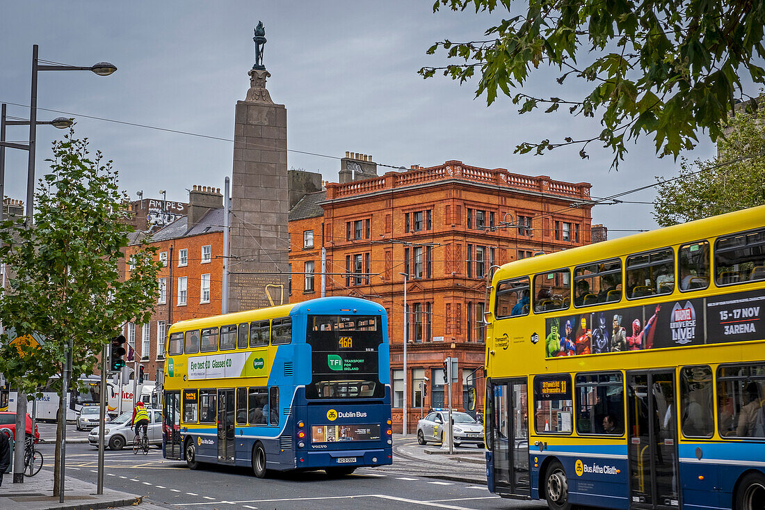 Buses and Parnell Monument, in O'Connell Street, Dublin, Ireland