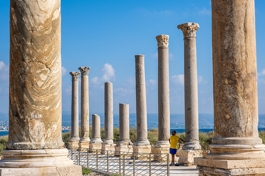 Man, tourist, in Al-Mina archaeological site, Tyre (Sour), Lebanon.