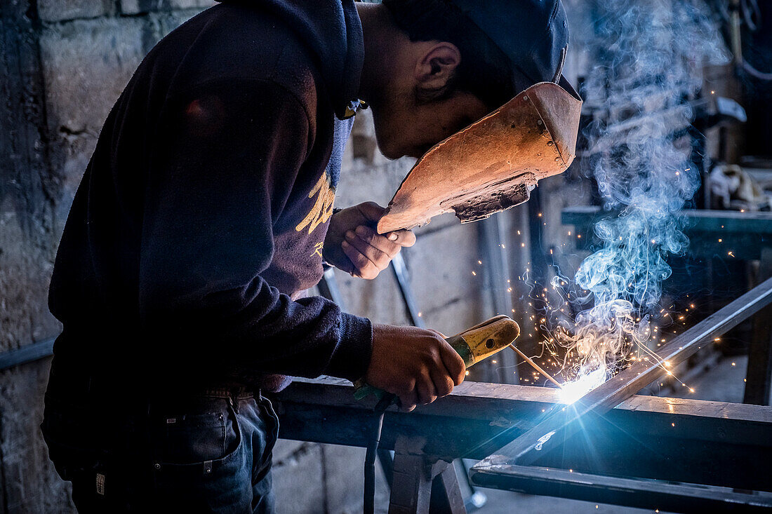 Ahmad, 16 years old, works with metals and dangerous machinery, child labour, syrian refugee, in Arsal, Bekaa Valley, Lebanon