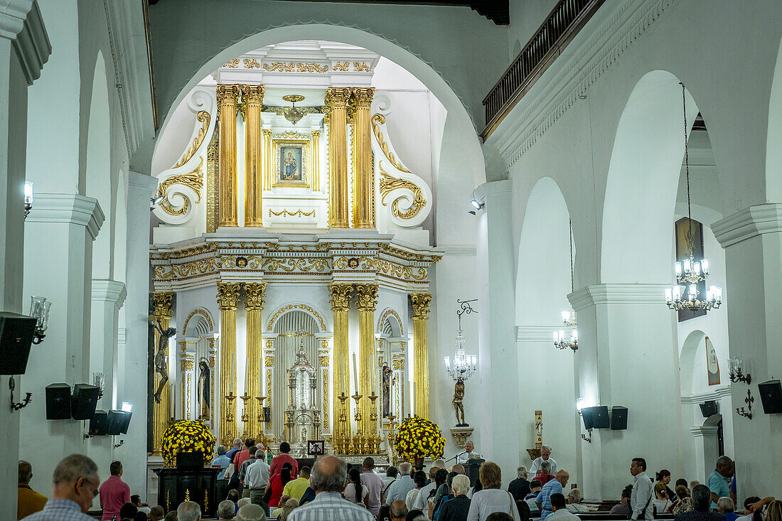 people praying, in Basilica of Our Lady of Candelaria, Medellín, Colombia