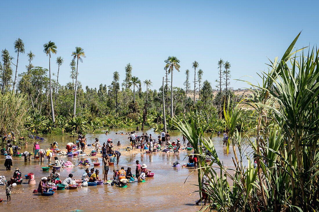 People washing clothes in the river of Ilakaka village, Madagascar