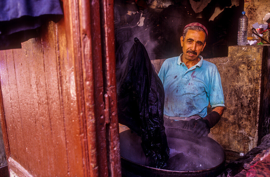 Dyer working, Medina, UNESCO World Heritage Site, Fez, Morocco, Africa.