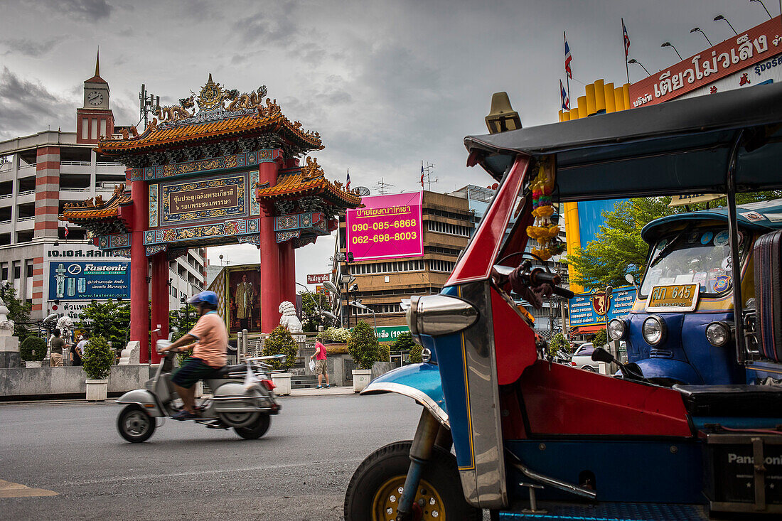 Traffic, in Chinatown Gate, known as the Wongwian Odeon, in Bangkok, Thailand