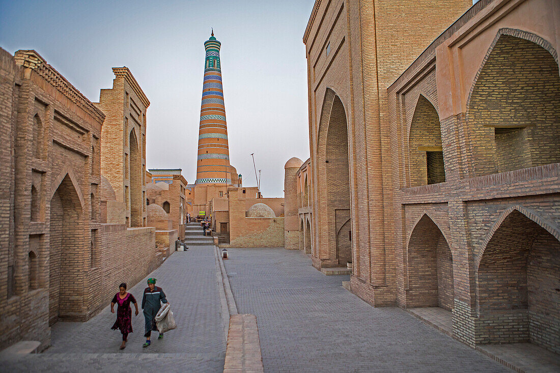 Islom Hoja Minaret. At right Sherghozi Khan Medressa. At left Pahlavon Mahmud Mausoleum, Khiva, Uzbekistan