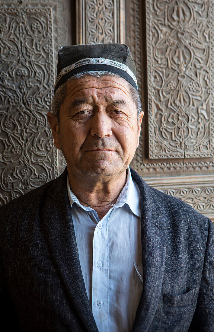 Uzbek man, vigilant of Rukhobod Mausoleum, Samarkand, Uzbekistan