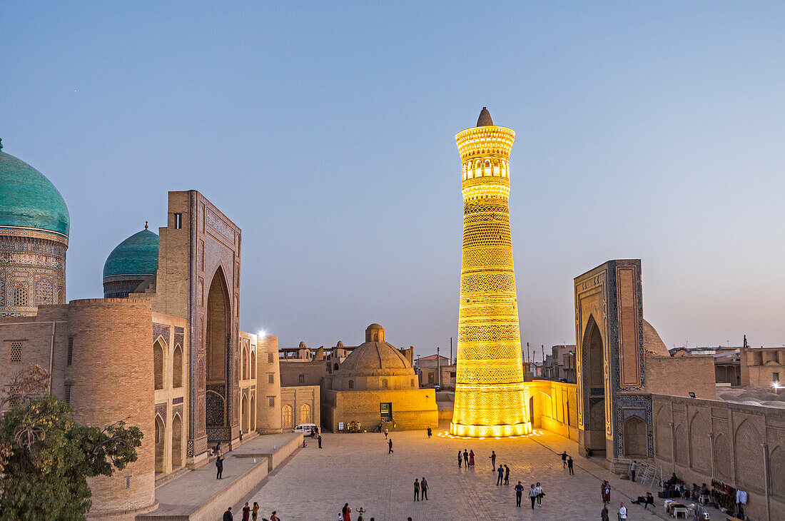 At right Kalon minaret and mosque. At left Mir-i-Arab medressa , Bukhara, Uzbekistan