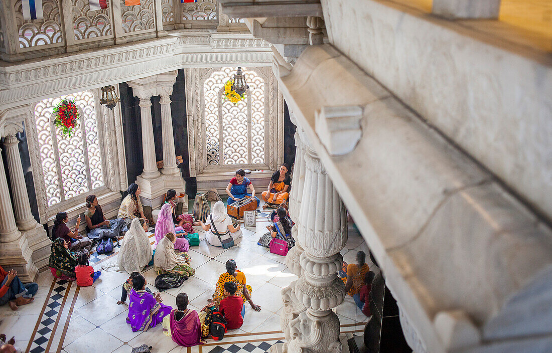 Group of people praying, in ISKCON temple, Sri Krishna Balaram Mandir,Vrindavan,Mathura, Uttar Pradesh, India