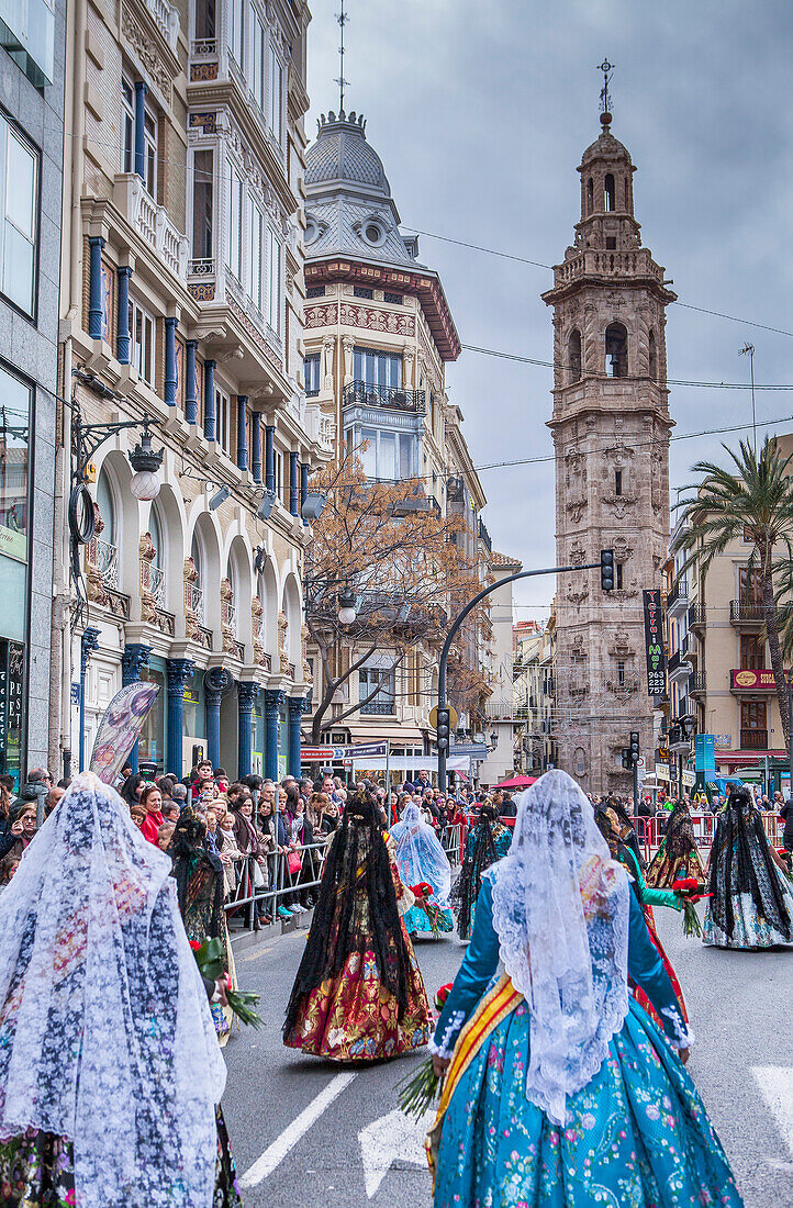 Flower offering parade,People with Floral tributes to `Virgen de los desamparados´, Fallas festival,San San Pau street,Valencia