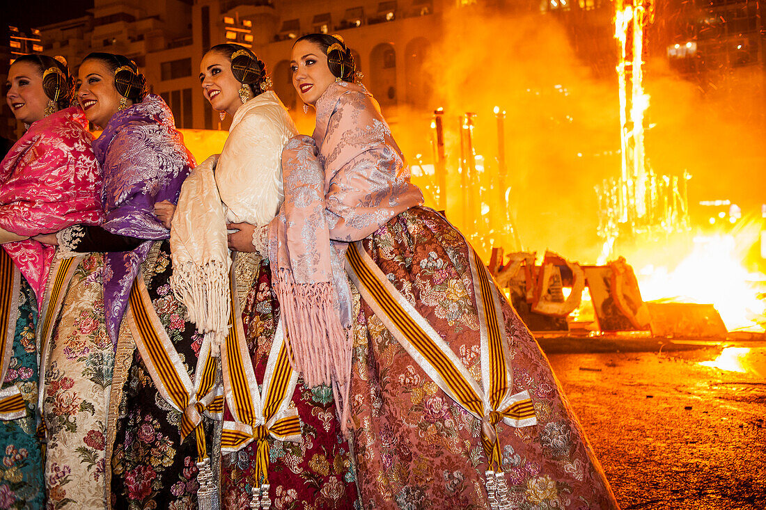 emotionalism during crema,Women of the municipal court of honor during the burning of municipal Falla, Valencia, Spain