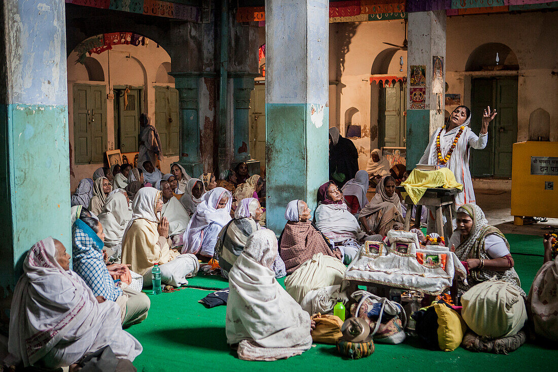 Widows praying in a Bhajan ashram, Vrindavan, Mathura district, India