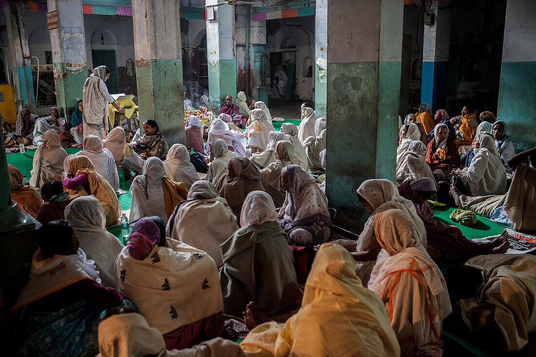 Widows praying in a Bhajan ashram, Vrindavan, Mathura district, India