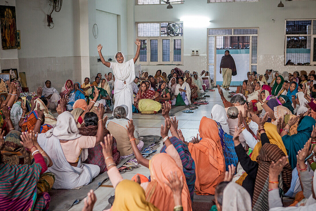 Widows praying in an Balaji ashram, Vrindavan, Mathura district, India
