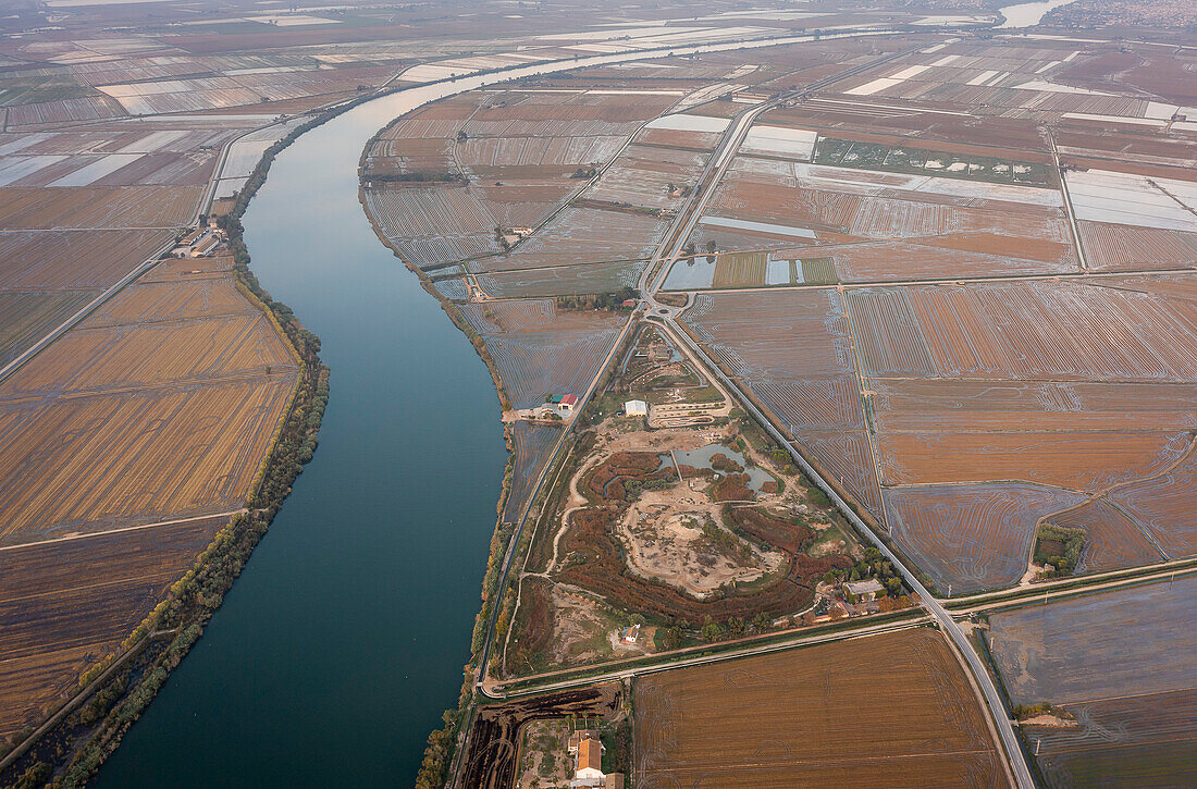 Aerial view of Ebro river and rice fields, in Ebro Delta, Natural Park, Tarragona, Spain