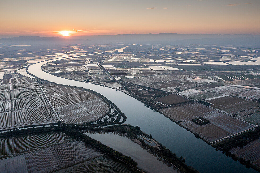 Aerial view of Ebro river and rice fields, in Ebro Delta, Natural Park, Tarragona, Spain