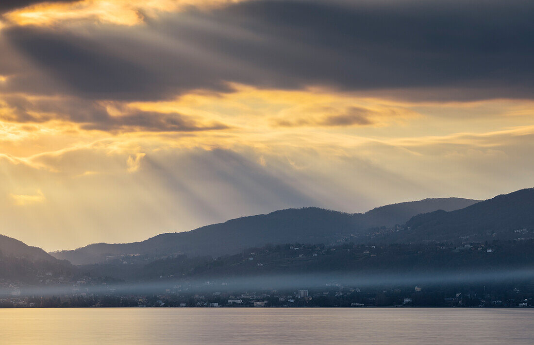 Sun rays at Ispra in front of Lake Maggiore, Varese, Lombardy, Italy, Southern Europe
