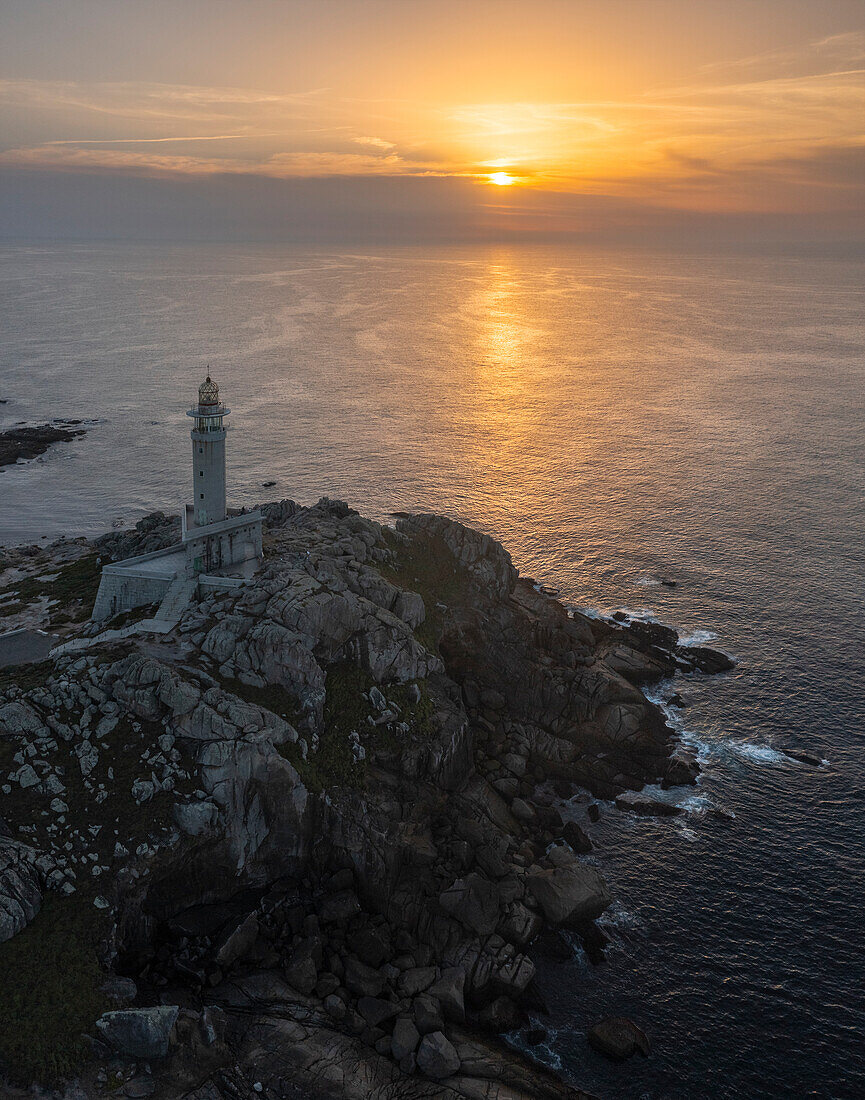 Aerial view of Punta Nariga lighthouse at sunset, Costa da Morte, Galicia, Spain, Iberian Peninsula, Western Europe