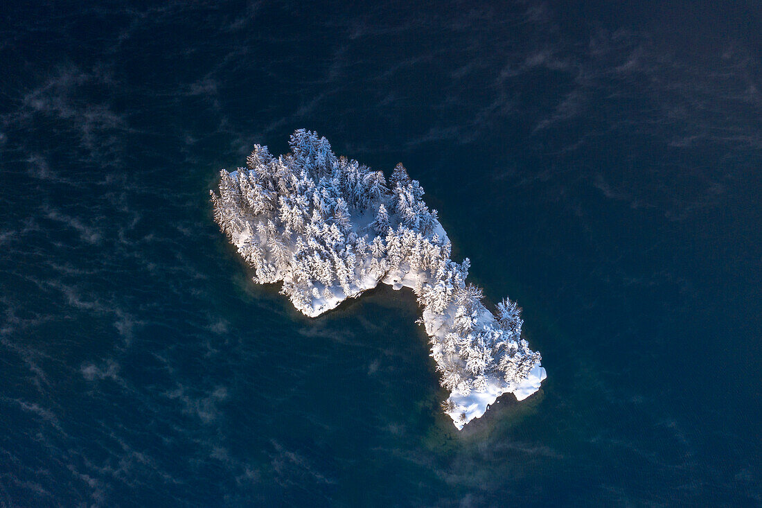 Aerial view of frozen island in Lake Sils, Plaun da Lej, Maloja region, Graubunden, Engadin, Switzerland