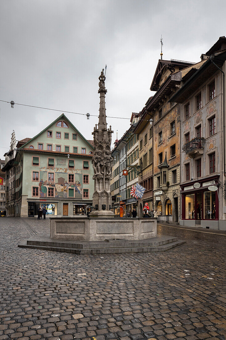 View of the beautiful fountain at Wein-markt platz square in Lucerne medieval old town. Lucerne, canton of Lucerne, Switzerland.