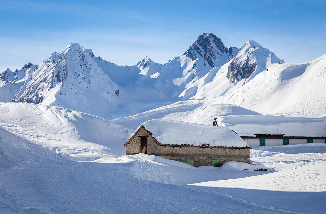 View of the Maria Luisa refuge in the high Formazza Valley in winter. Riale, Formazza, Valle Formazza, Verbano Cusio Ossola, Piedmont, Italy.