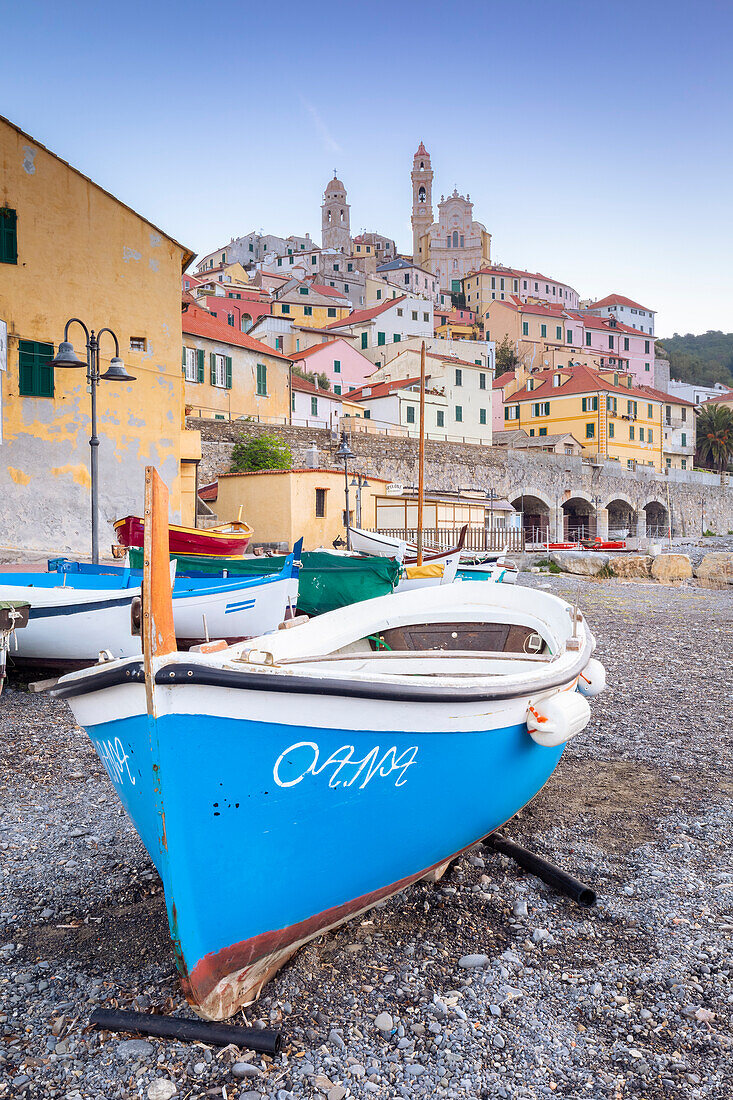 View of the colorful town of Cervo and boat on it's beach. Cervo, Imperia province, Ponente Riviera, Liguria, Italy, Europe.